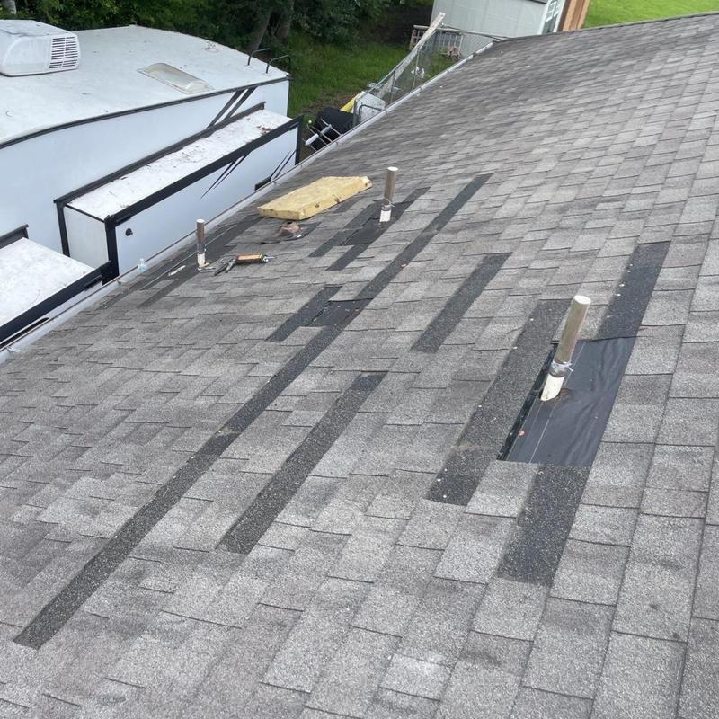 Plumbing vent flashings on shingled residential roof