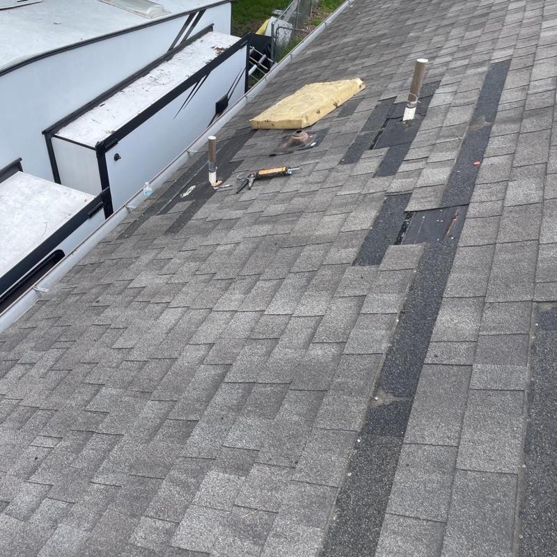 Plumbing vent pipe flashing and shingle replacement on roof