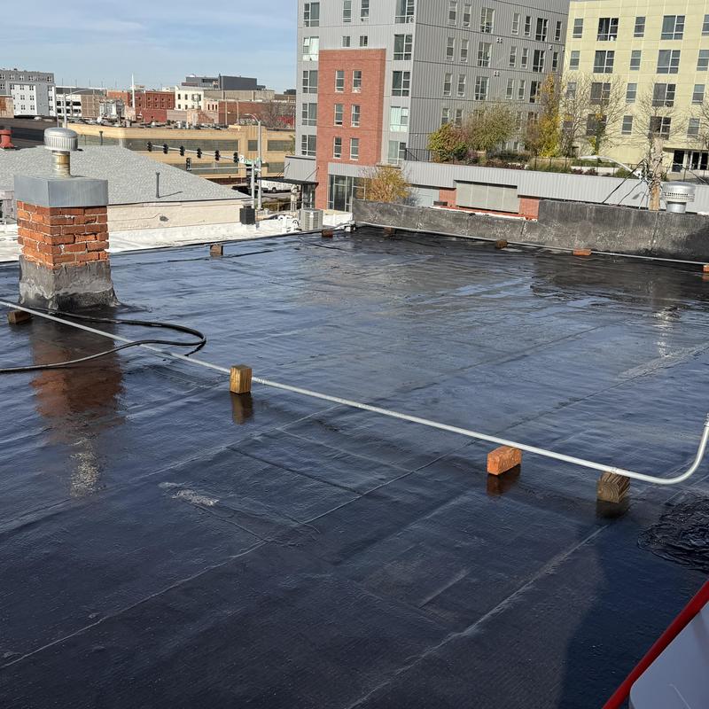 SEBS roof coating on flat commercial roof in Lincoln