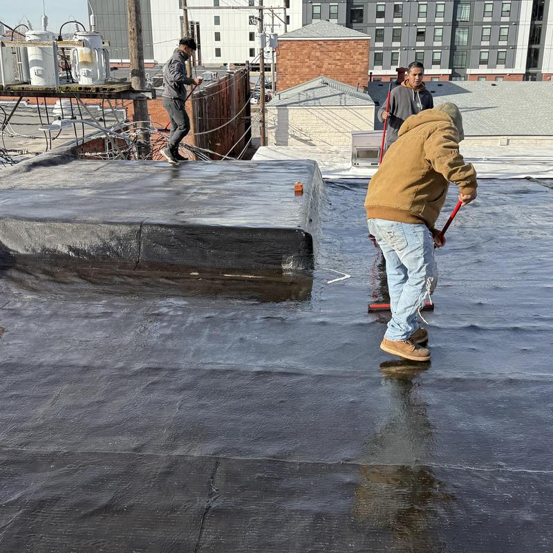 ARC DynaSHIELD SEBS roof coating application on flat roof