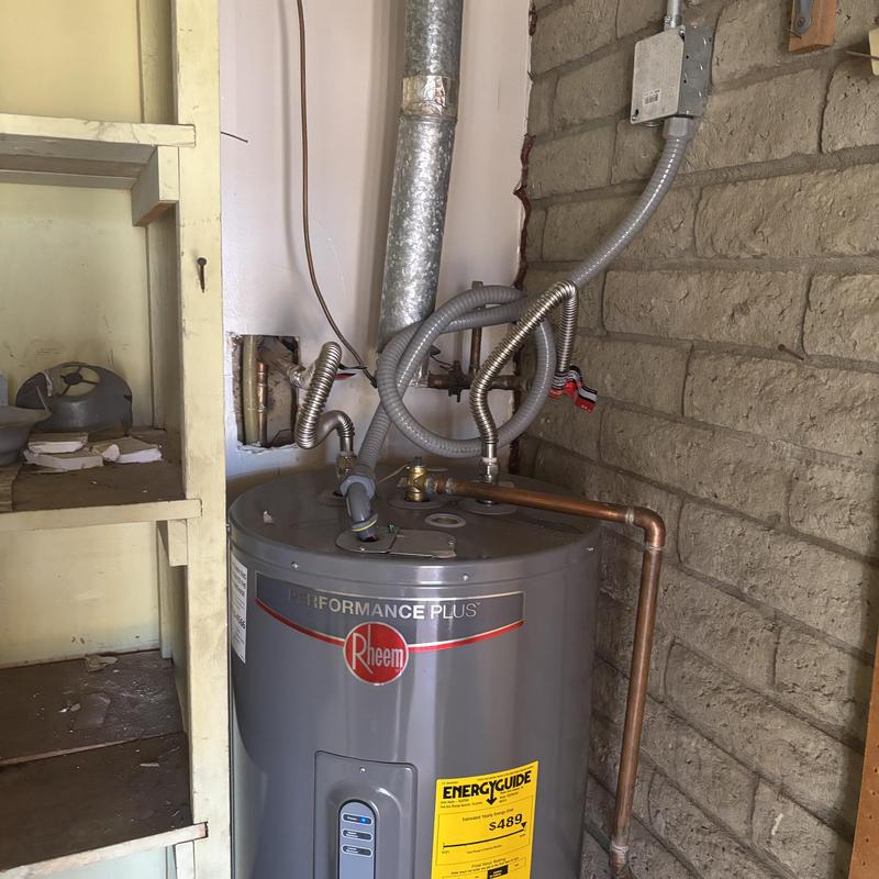 Water heater with new plumbing connections installation