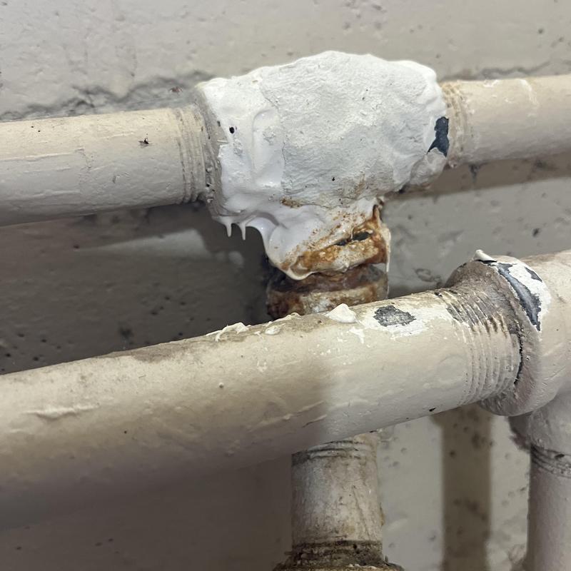 Galvanized piping with rust and leak sealant applied Galvanized piping with rust and leak sealant applied