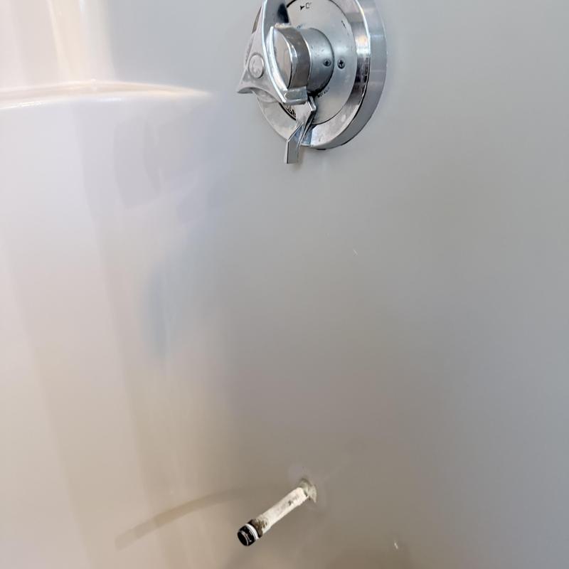 Shower valve and faucet installation in white tub wall