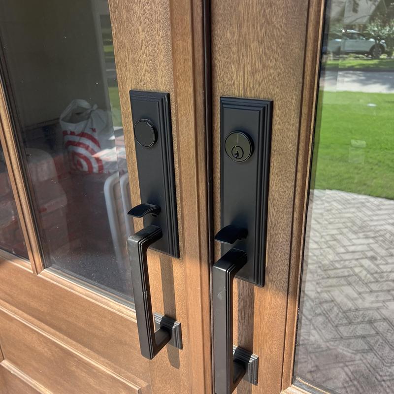 Front door deadbolt and handle set on wood door
