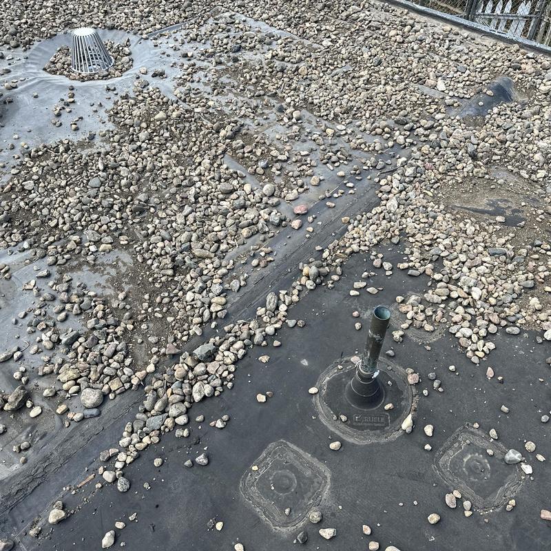 Flat roof membrane with gravel and vent pipe Flat roof membrane with gravel and vent pipe