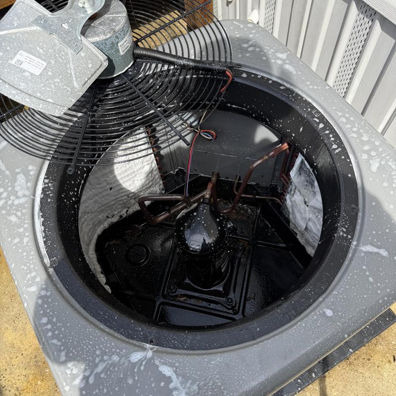 Air conditioner condenser unit interior during cleaning and inspection Air conditioner condenser unit interior during cleaning and inspection