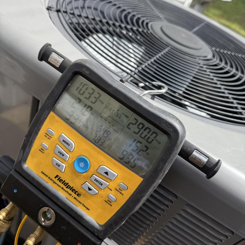 HVAC condenser manifold gauge showing pressure readings HVAC condenser manifold gauge showing pressure readings