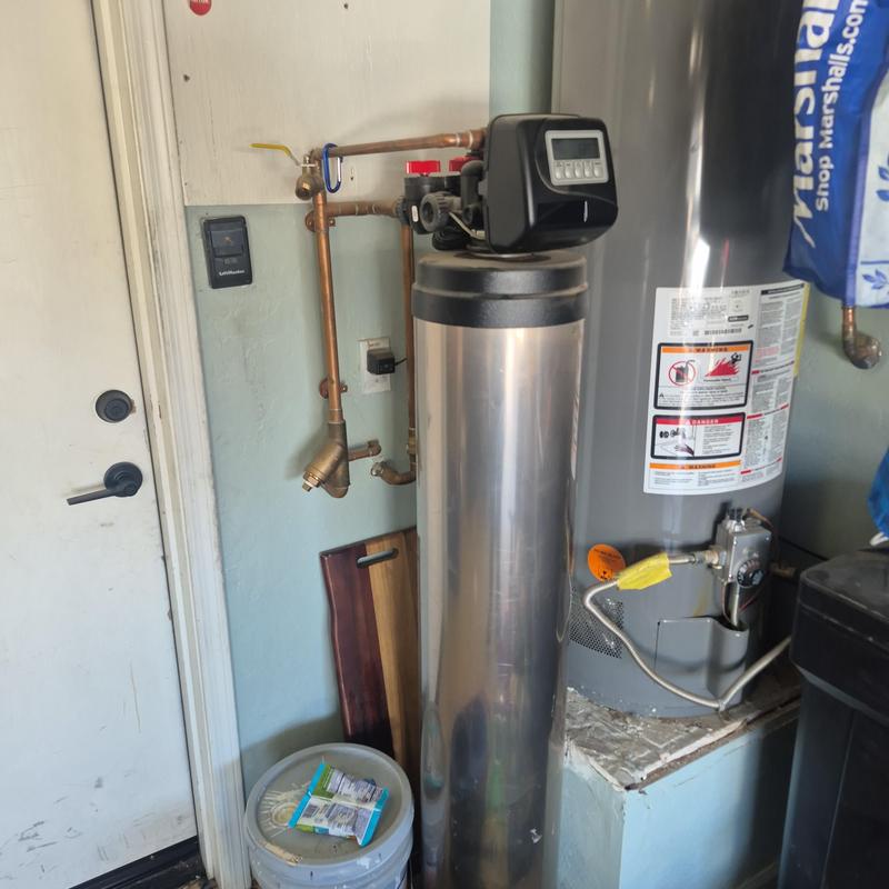 Water softener system with control valve and pipes