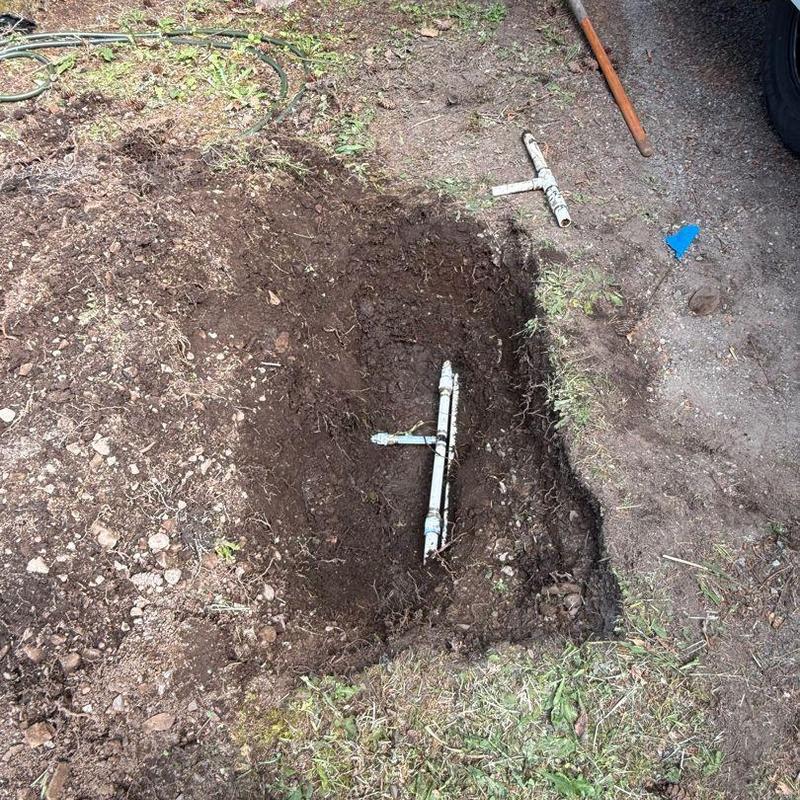 Main water line exposed for leak repair and inspection