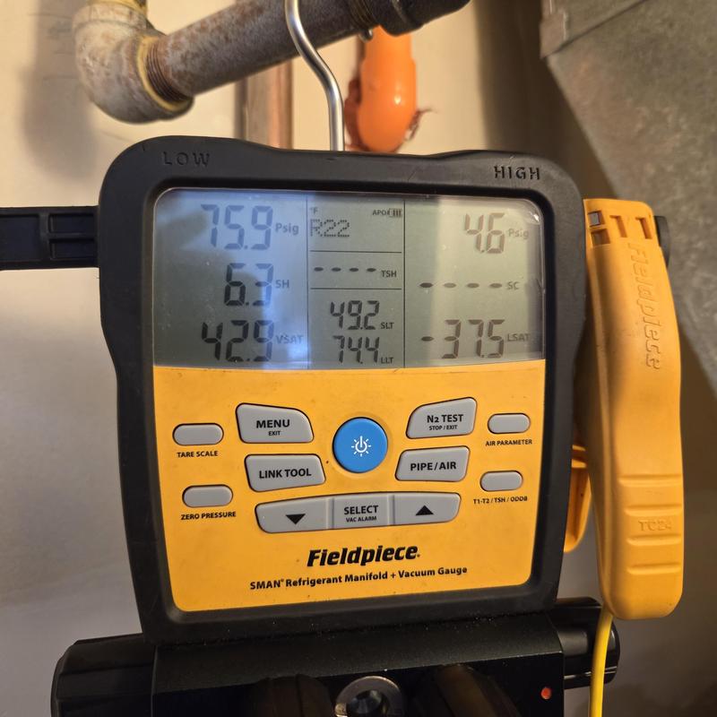Refrigerant manifold gauge measuring AC pressures Refrigerant manifold gauge measuring AC pressures