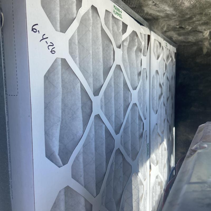 Air filter installation in HVAC system compartment Air filter installation in HVAC system compartment