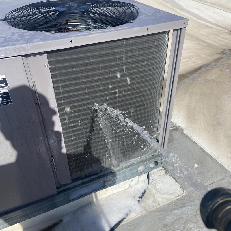 Rooftop unit condenser coil leak spraying water outdoors Rooftop unit condenser coil leak spraying water outdoors