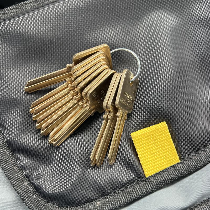 House keys on key ring inside black bag pocket House keys on key ring inside black bag pocket