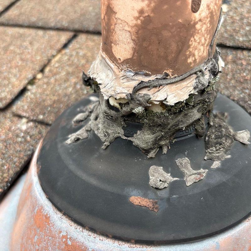 Roof pipe flashing with damaged sealant and corrosion