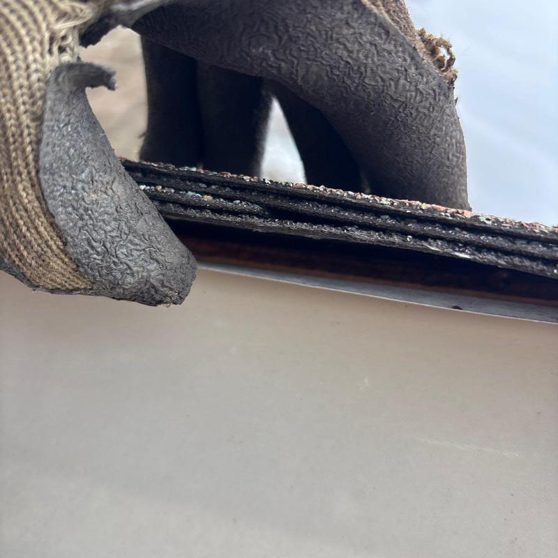 Asphalt roofing shingles with hail damage close-up