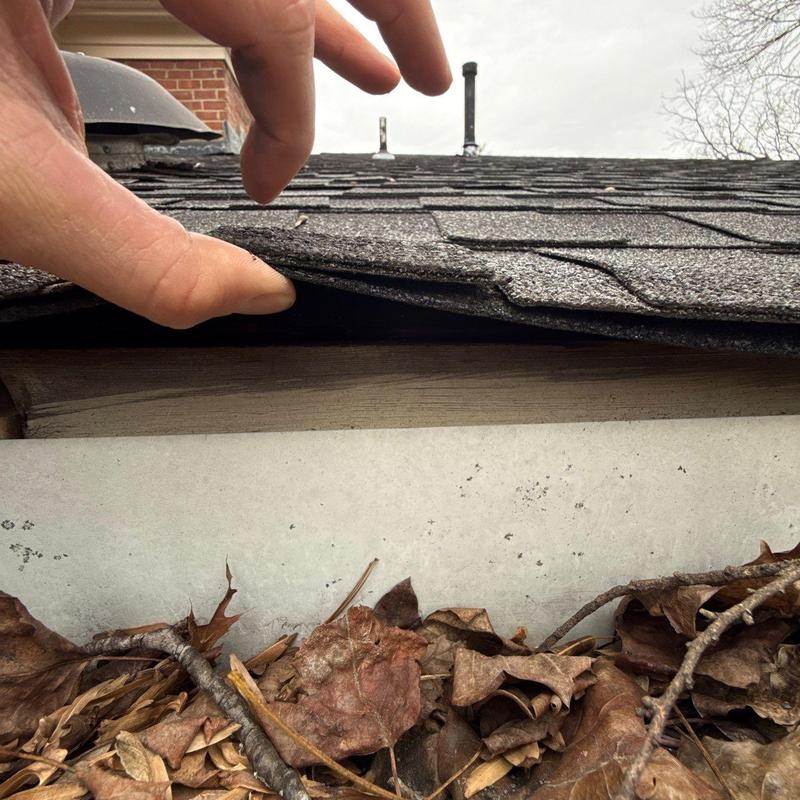 Asphalt shingles lifted for roof inspection in Brentwood