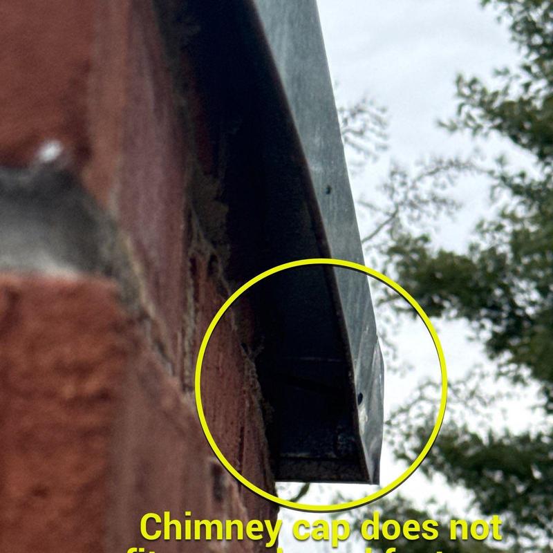 Chimney cap with visible rust and damage