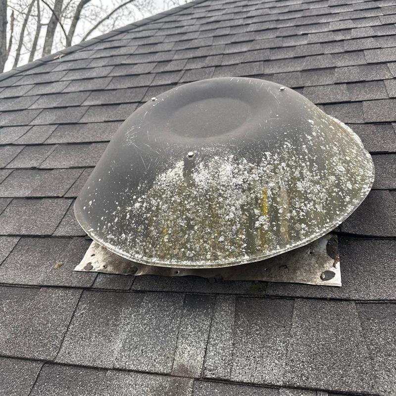 Roof ventilation cover with hail and moss damage