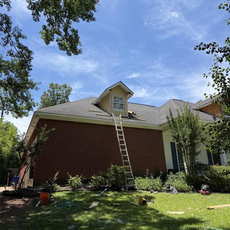 Dormer siding replacement with ladder on roof