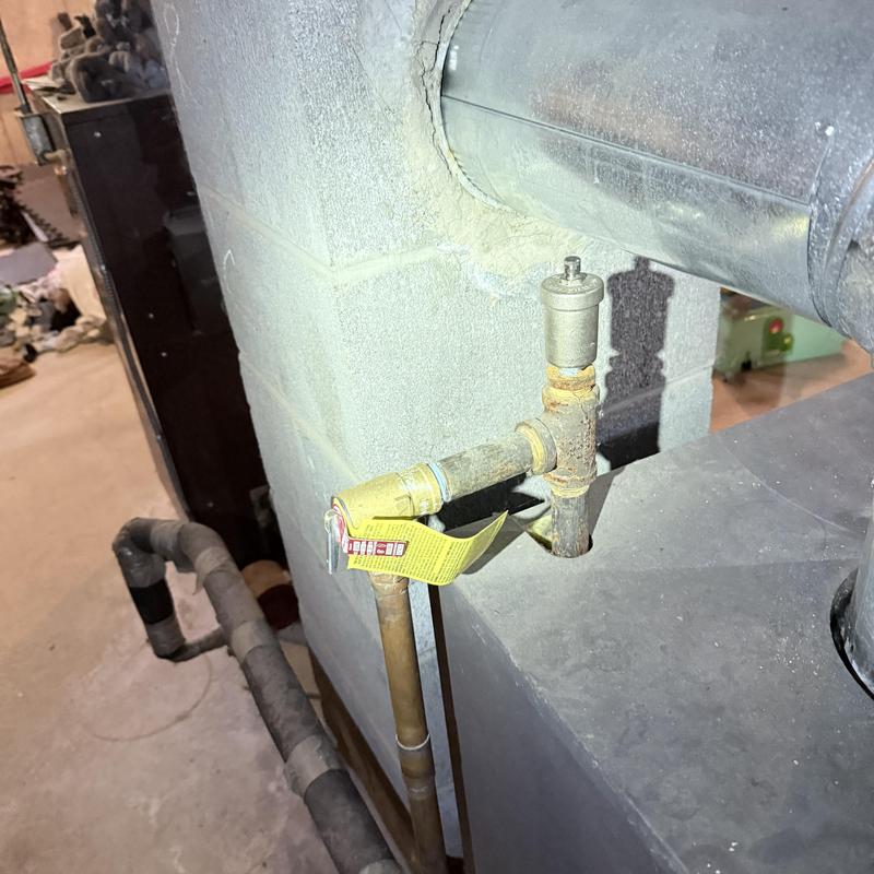 Boiler relief valve and pipe connections with tag