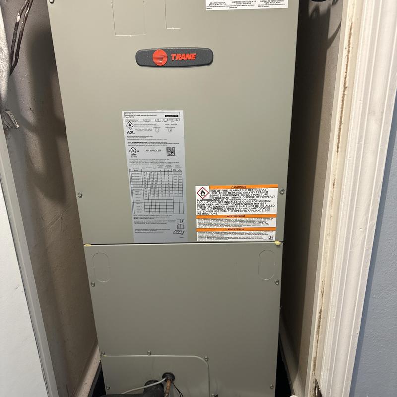 Trane air handler unit installed in residential closet Trane air handler unit installed in residential closet