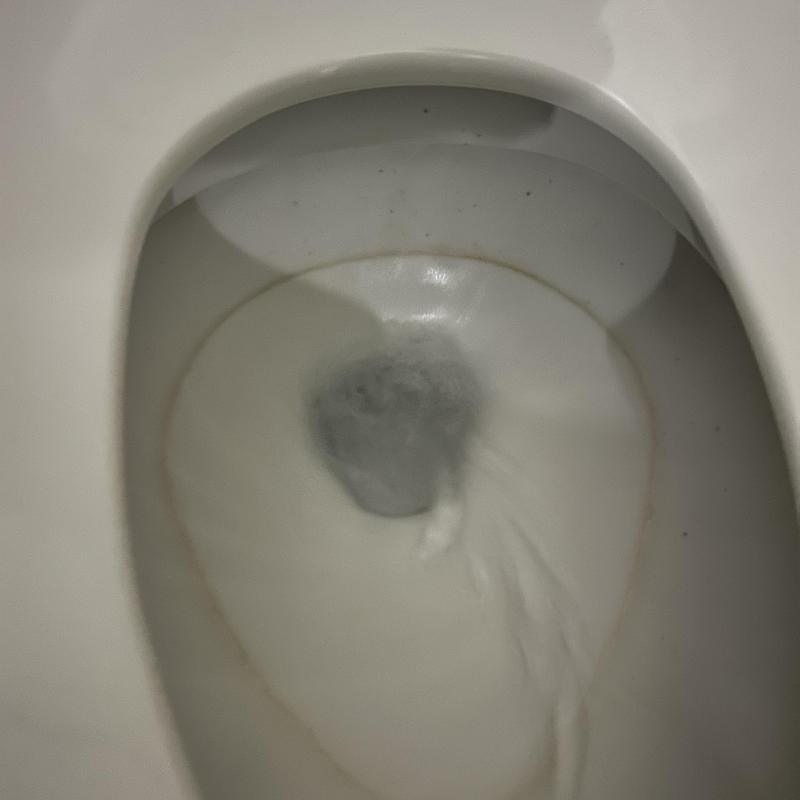 Toilet bowl flushing with visible water flow Toilet bowl flushing with visible water flow