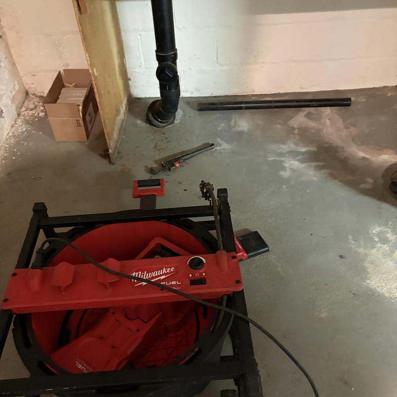 Drain jetting machine near basement drain pipe Drain jetting machine near basement drain pipe