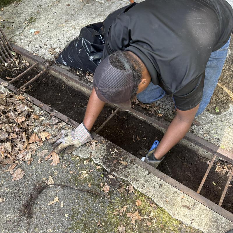 Driveway catch basin cleaning with hand tools Driveway catch basin cleaning with hand tools