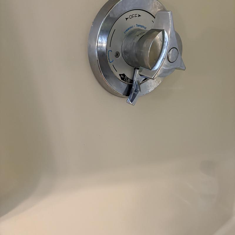 Shower valve handle and temperature control assembly