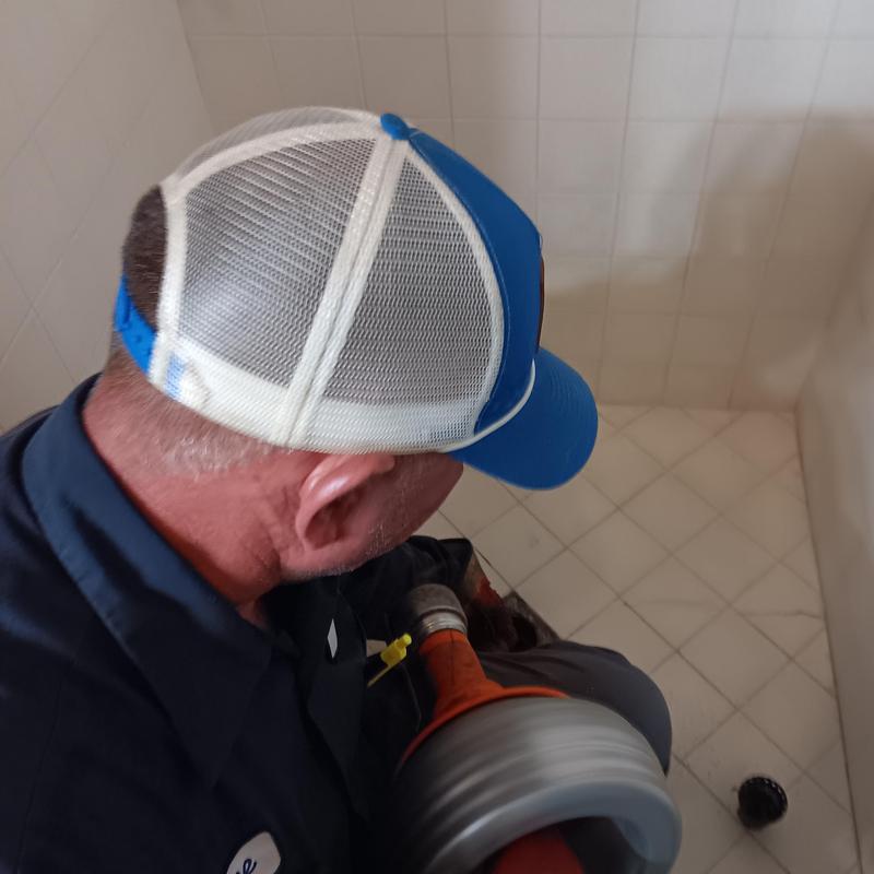 Bathtub drain clog cleaning with plumber tool