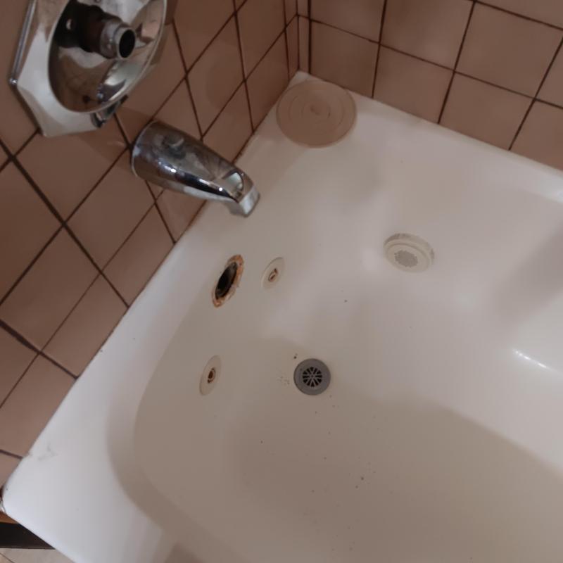 Bathtub drain and faucet with missing handle parts