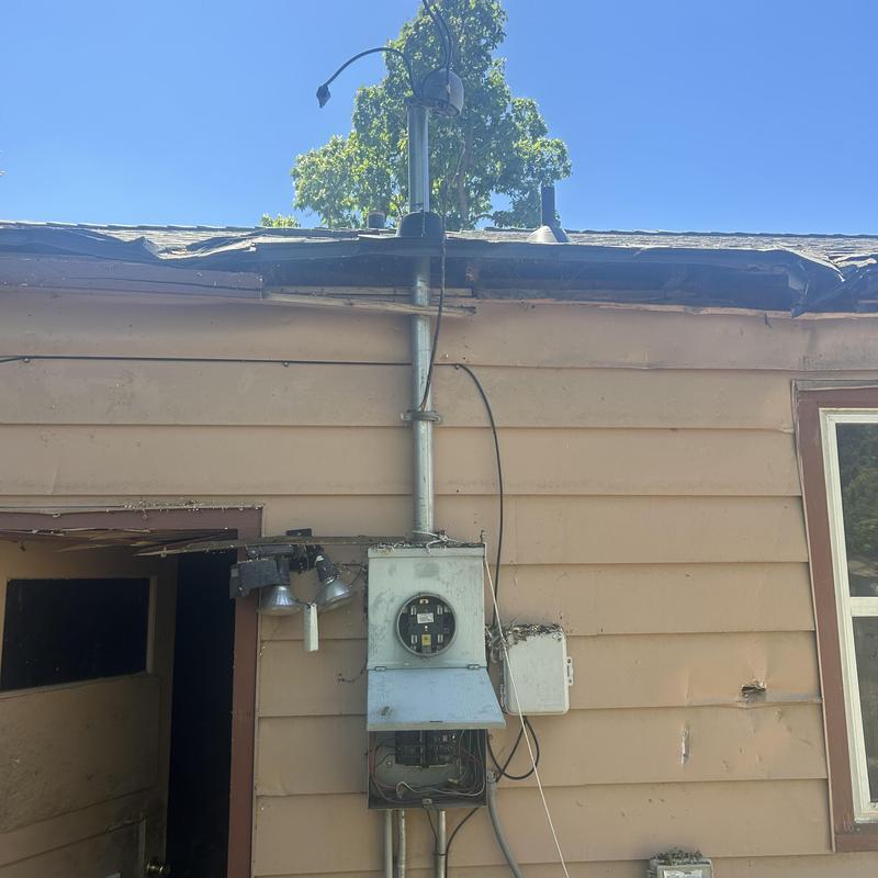 2-inch weatherhead and roof boot installation on home 2-inch weatherhead and roof boot installation on home
