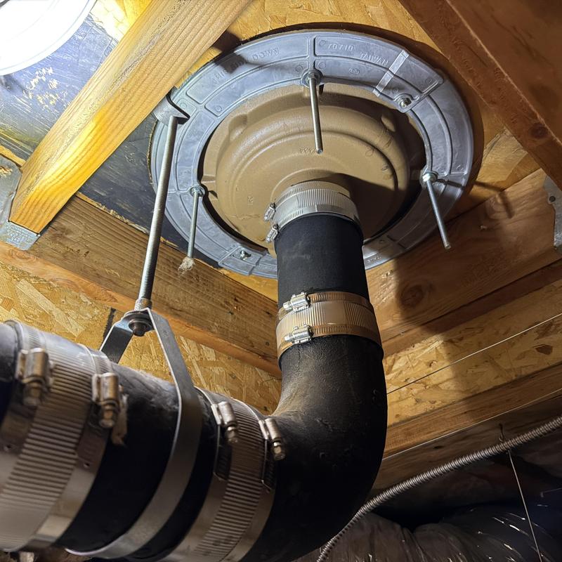 Roof drain pipe with metal clamps and supports Roof drain pipe with metal clamps and supports