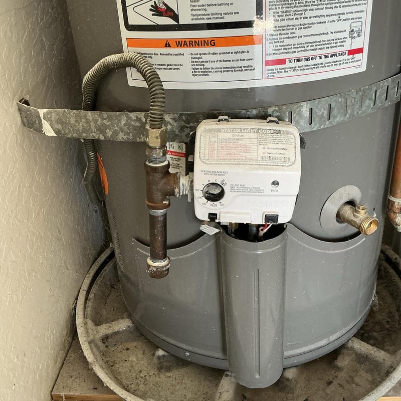 Water heater gas valve and pipe fittings with Teflon tape replacement Water heater gas valve and pipe fittings with Teflon tape replacement