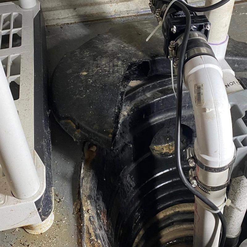 Sump pump basin with PVC check valve installation