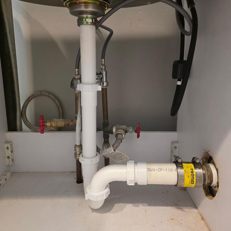 Laundry sink P trap with drain and water pipes installed