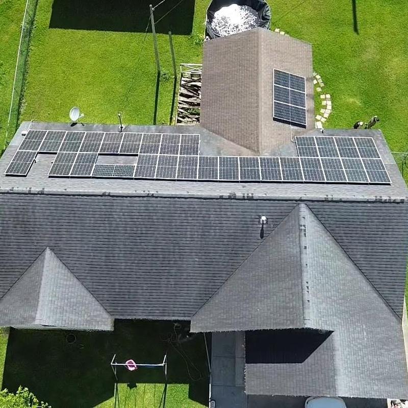 Solar panels on Owens Corning Duration roof installation
