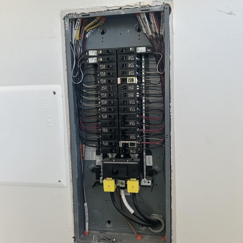 Electrical breaker panel with wiring in wall cavity