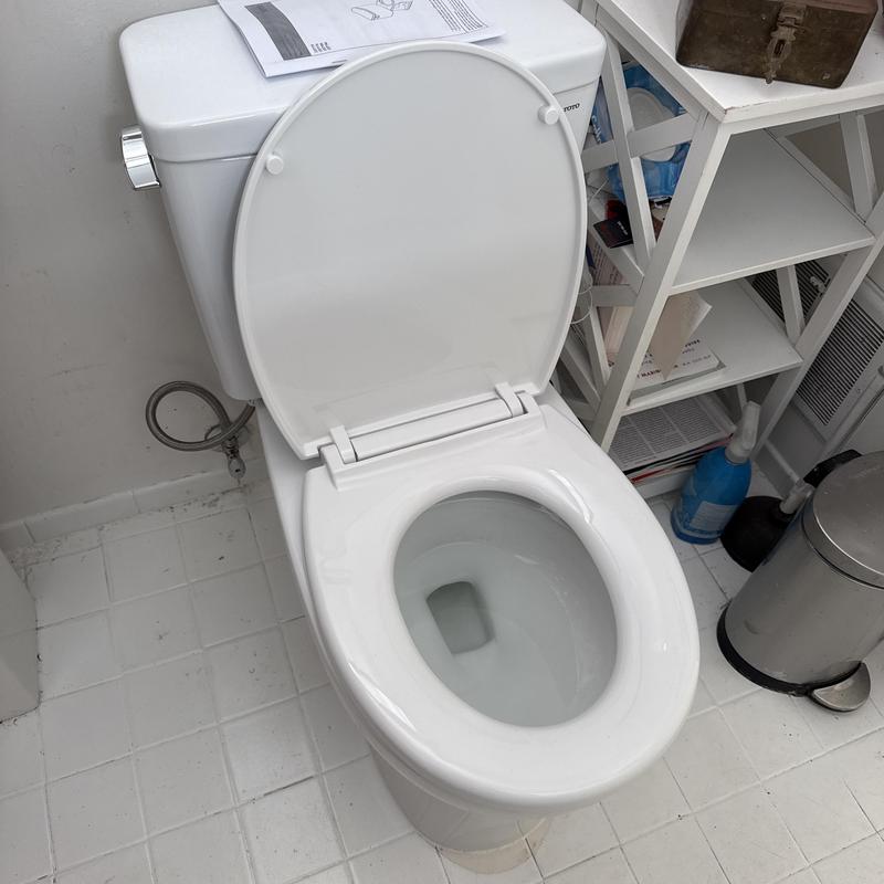 Toto toilet with new wax ring and supply line installation