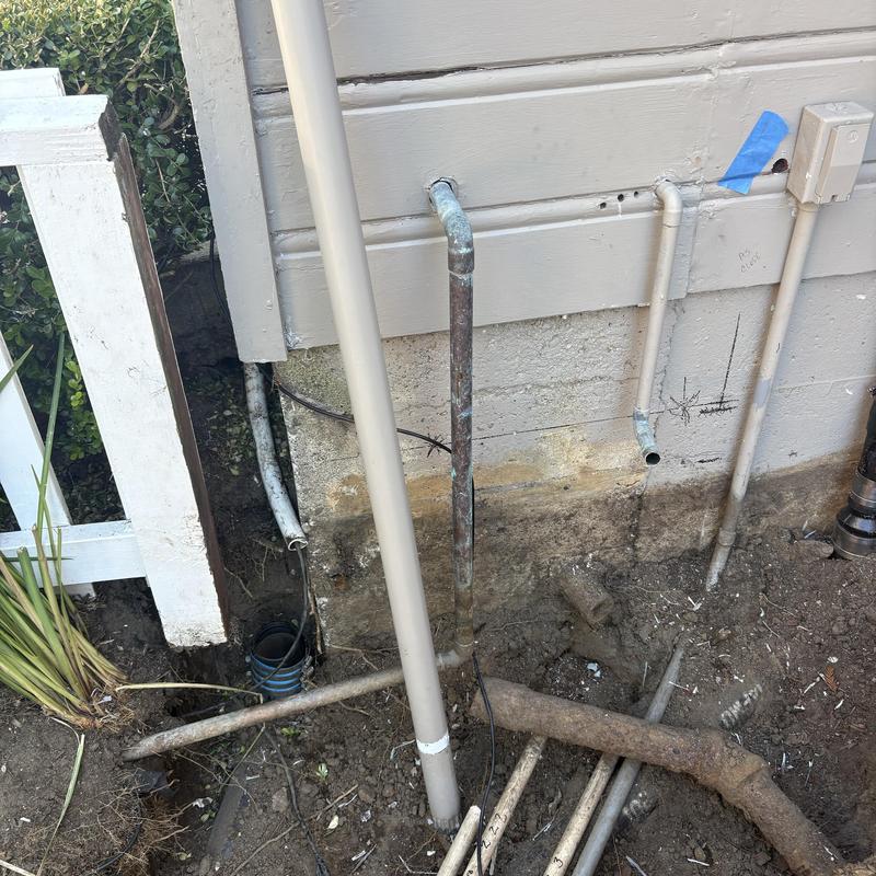 Water line relocation with irrigation line reroute outdoors