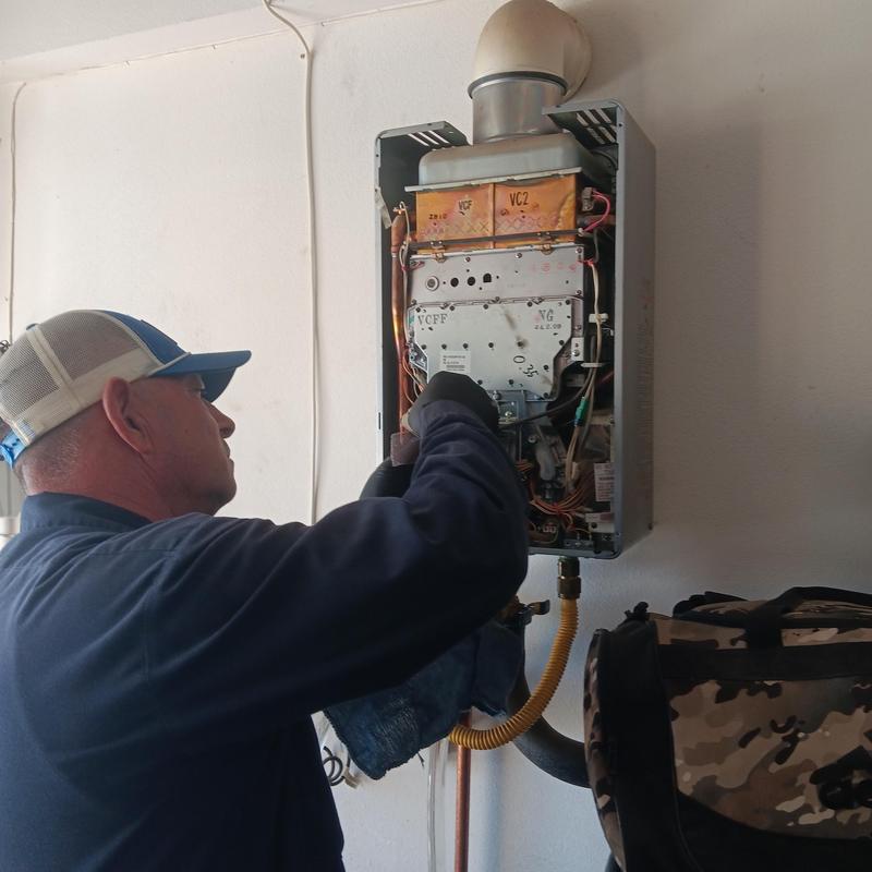 Burner assembly cleaning in tankless water heater
