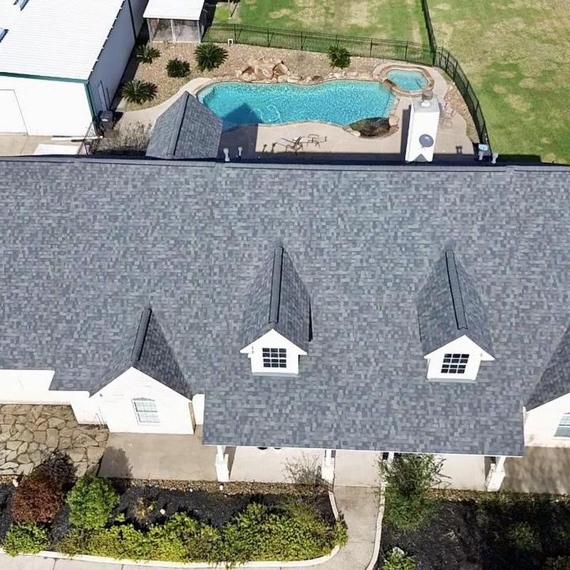 Duration Estate Grey asphalt shingle roof with pool view