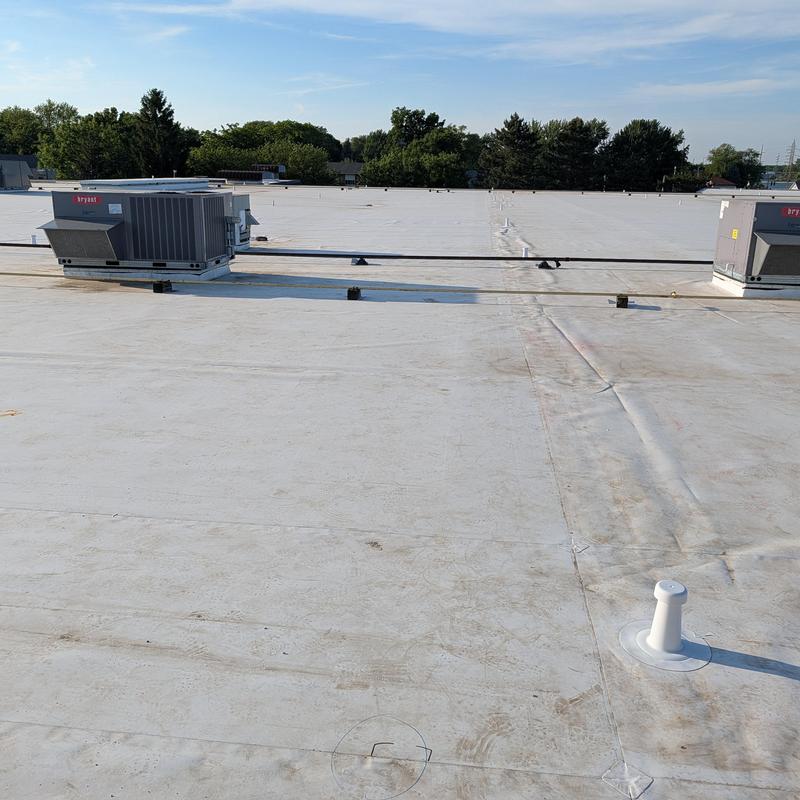TPO single ply flat commercial roof with HVAC units TPO single ply flat commercial roof with HVAC units