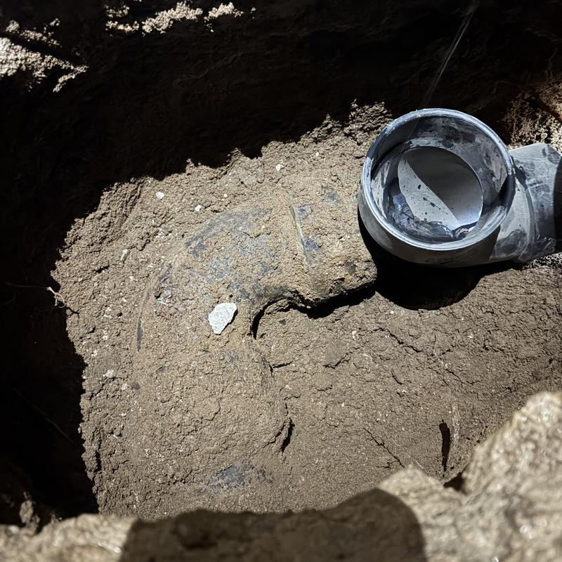 Sewer main line excavation and pipe exposure Sewer main line excavation and pipe exposure