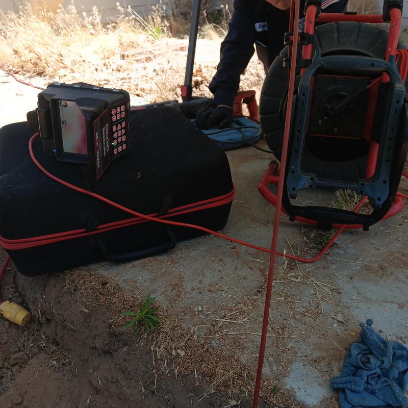 Sewer line inspection camera and locating equipment outdoors