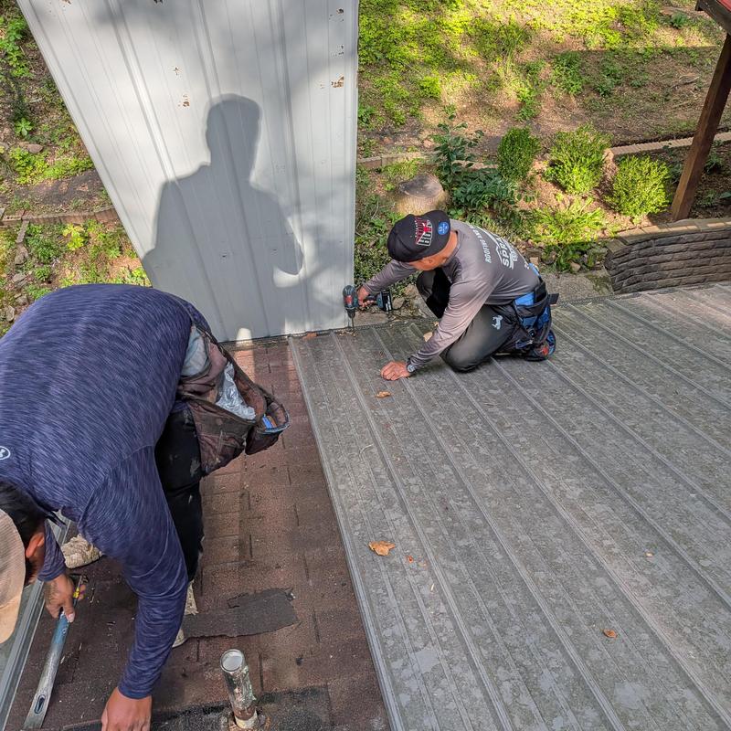 Metal roof panel fastening and alignment in Hampton Cove Metal roof panel fastening and alignment in Hampton Cove