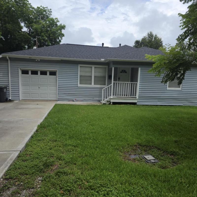 Architectural shingle roof with porch and driveway