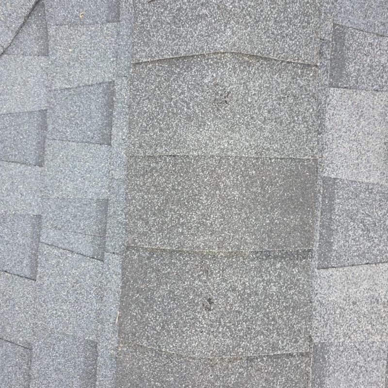 Architectural roof shingles with granule loss close-up