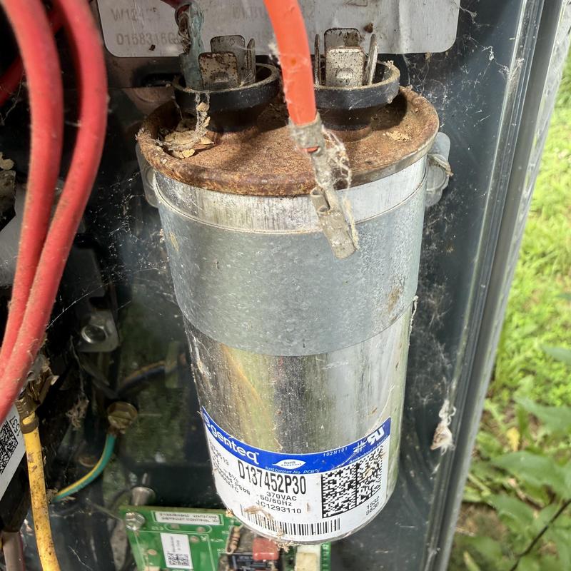 Capacitor and wiring on HVAC unit with rust and dust Capacitor and wiring on HVAC unit with rust and dust