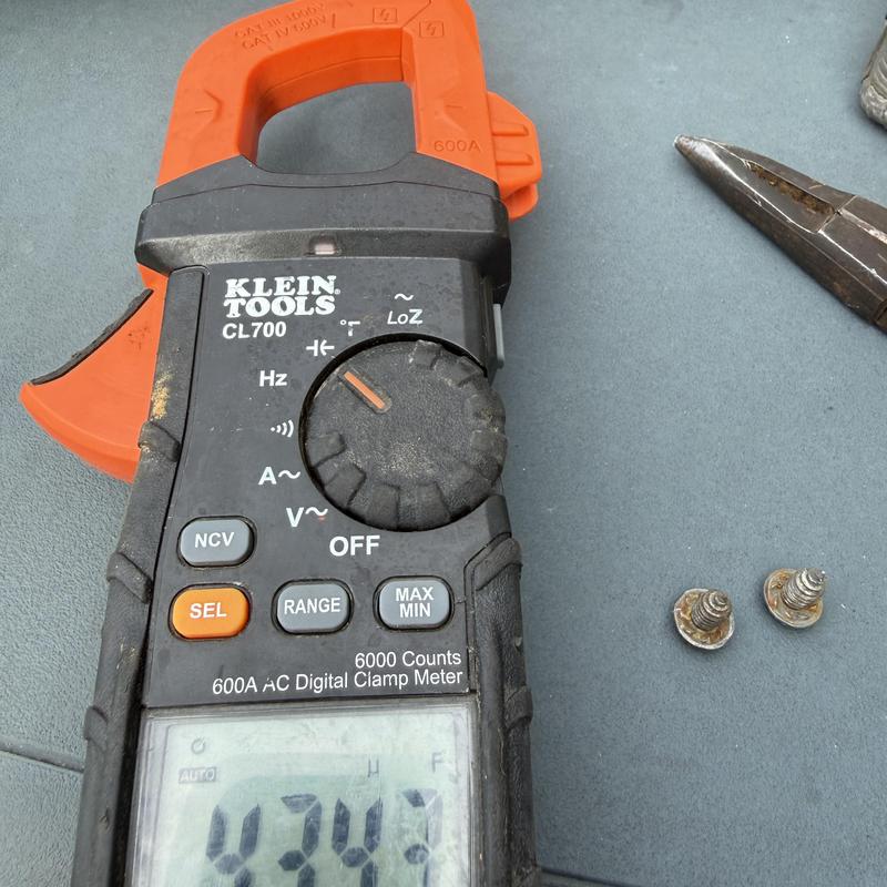 Digital clamp meter measuring electrical current Digital clamp meter measuring electrical current